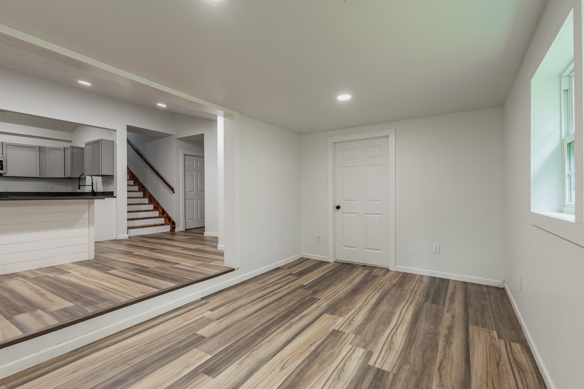 2635 McBrides Branch Road Beechgrove, TN 37018 - Photo 25 of 54 a view of a hallway with wooden floor and staircase