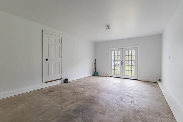 a view of a room with wooden floor and stairs