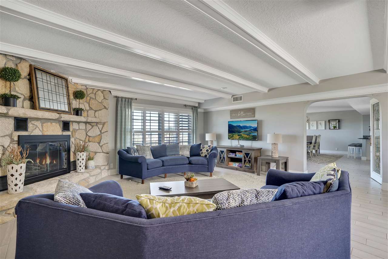 5072 Atlantic View St. Augustine, FL 32080 - Photo 11 of 40 a living room with fireplace furniture and a large window