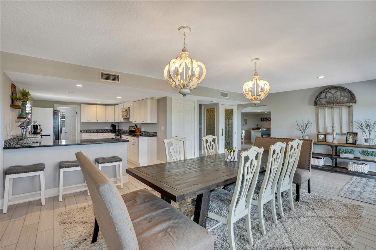 5072 Atlantic View St. Augustine, FL 32080 - Photo 12 of 40 a view of a dining room with furniture and wooden floor