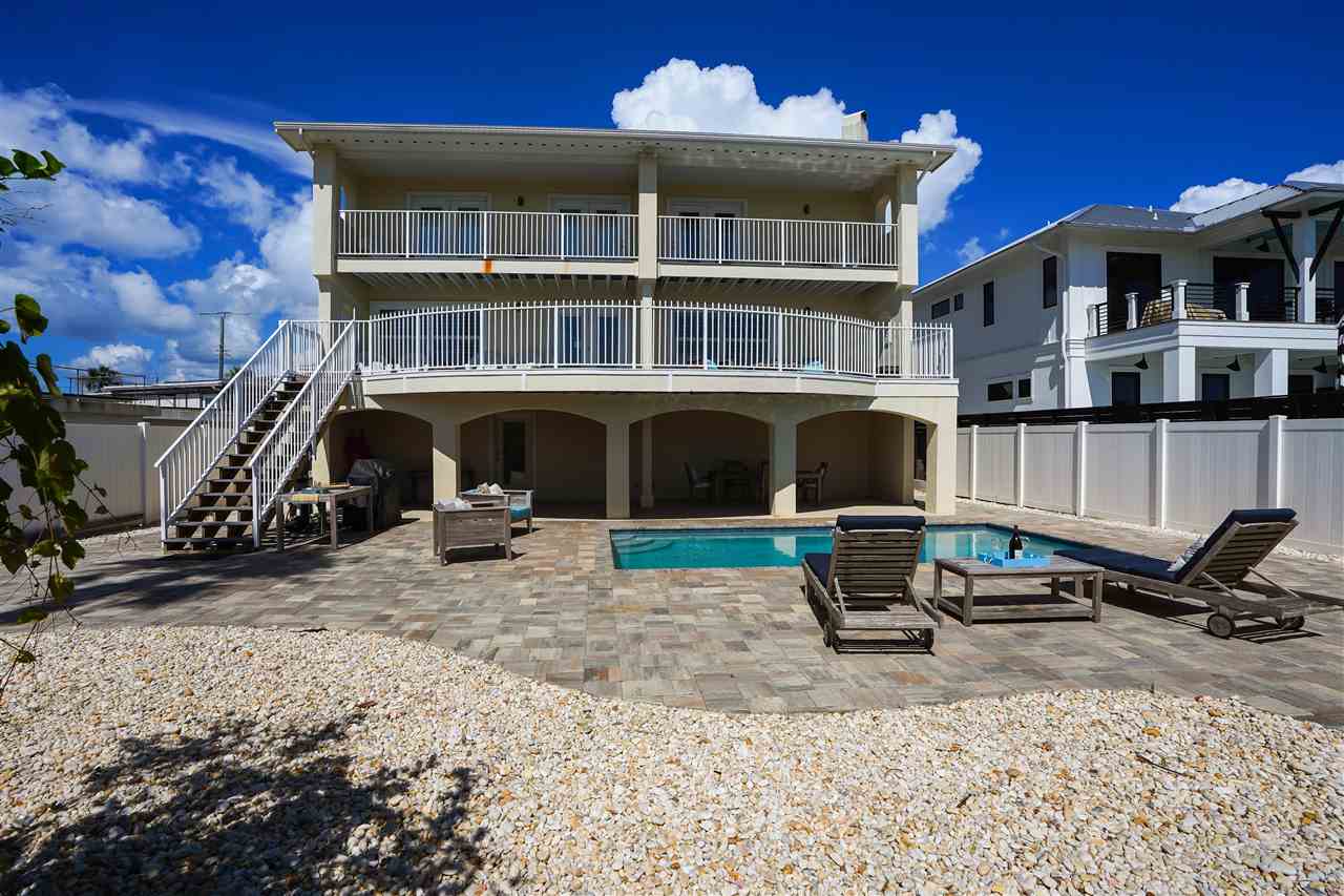 5072 Atlantic View St. Augustine, FL 32080 - Photo 3 of 40 a front view of a house with a yard