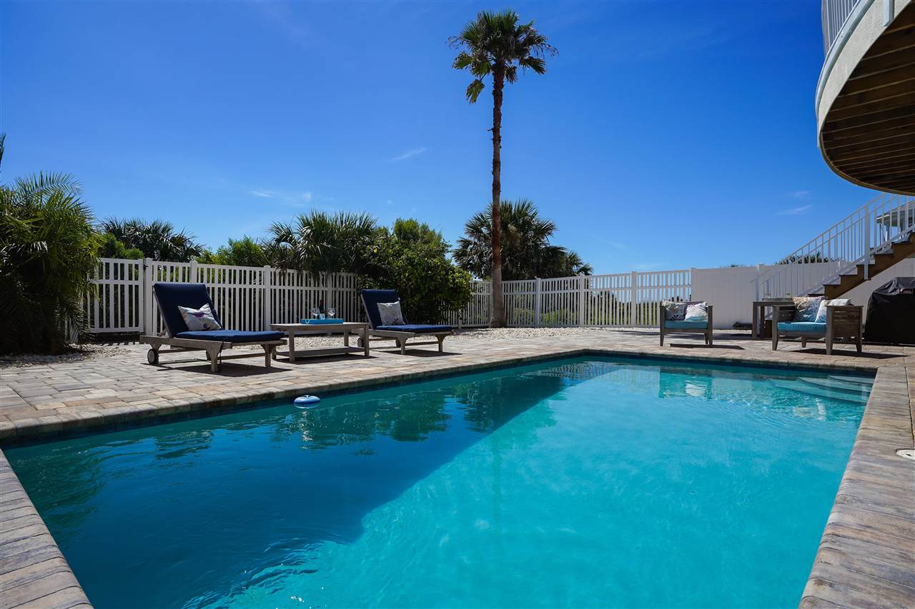 5072 Atlantic View St. Augustine, FL 32080 - Photo 4 of 40 a backyard of a house with table and chairs