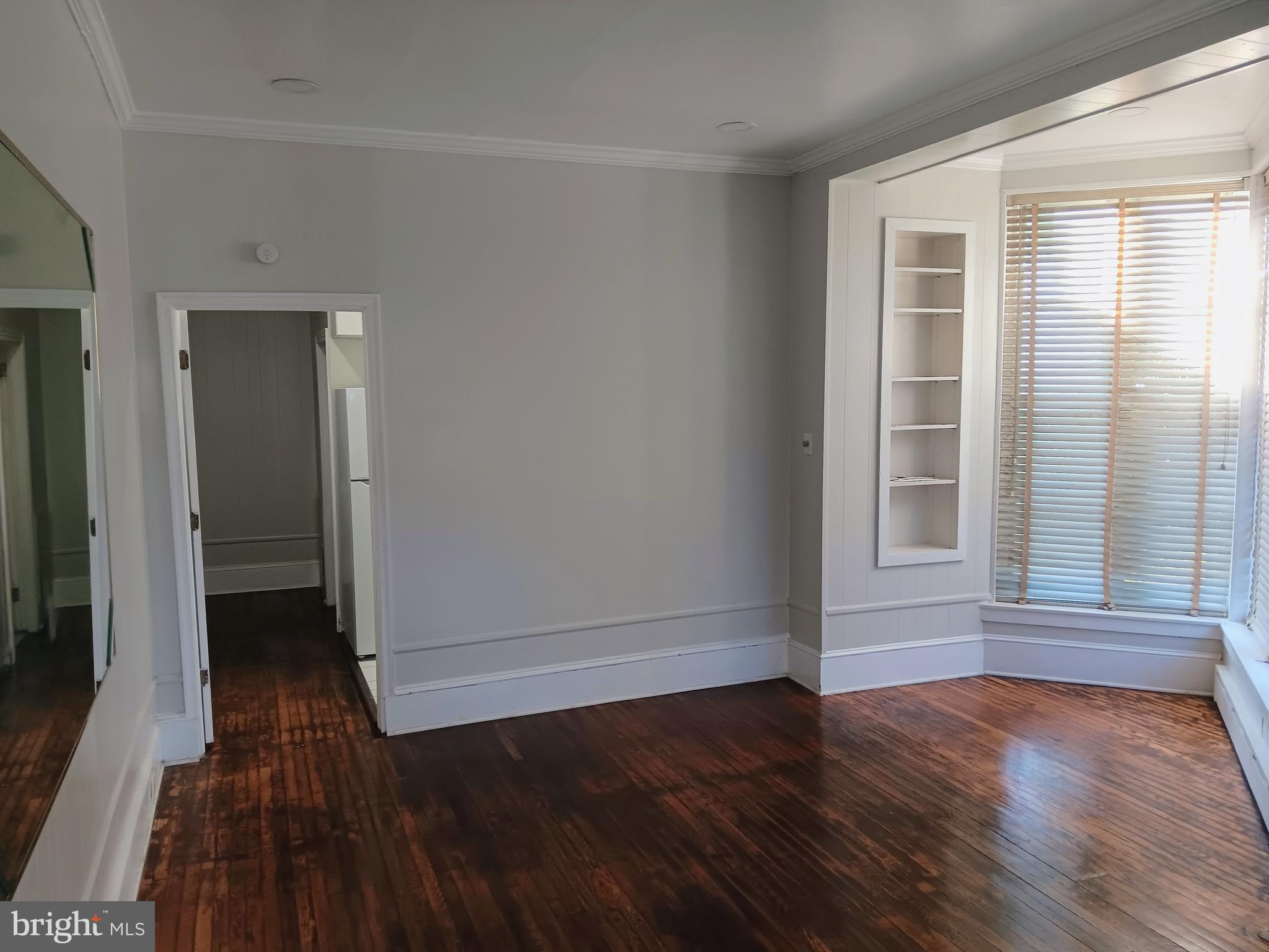 1342 Orthodox Street, Unit 2 Philadelphia, PA 19124 - Photo 3 of 6 wooden floor in an empty room with a window