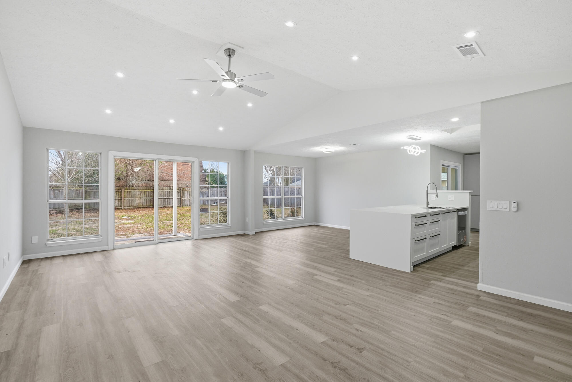 1434 Santa Anita Drive Lynn Haven, FL 32444 - Photo 11 of 38 a view of an empty room with wooden floor and a window
