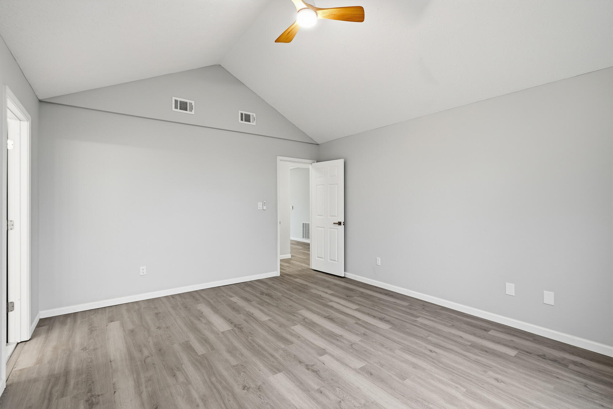1434 Santa Anita Drive Lynn Haven, FL 32444 - Photo 18 of 38 a view of an empty room with wooden floor