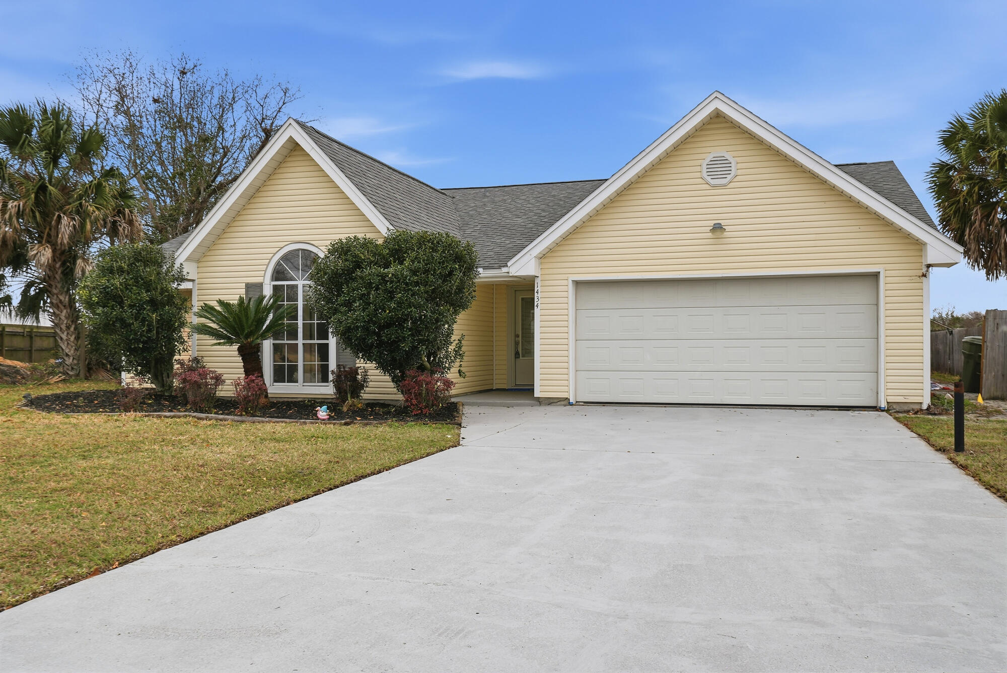 1434 Santa Anita Drive Lynn Haven, FL 32444 - Photo 2 of 38 a view of a house with a yard and garage