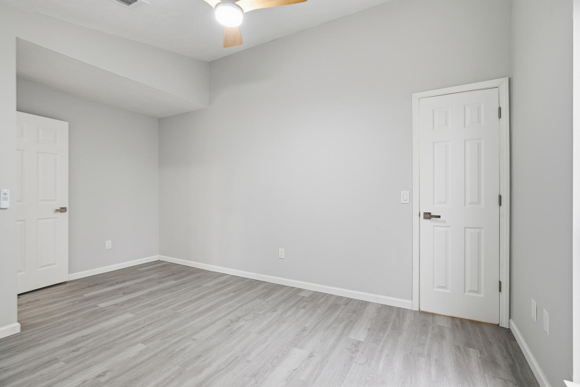 1434 Santa Anita Drive Lynn Haven, FL 32444 - Photo 22 of 38 a view of an empty room with wooden floor