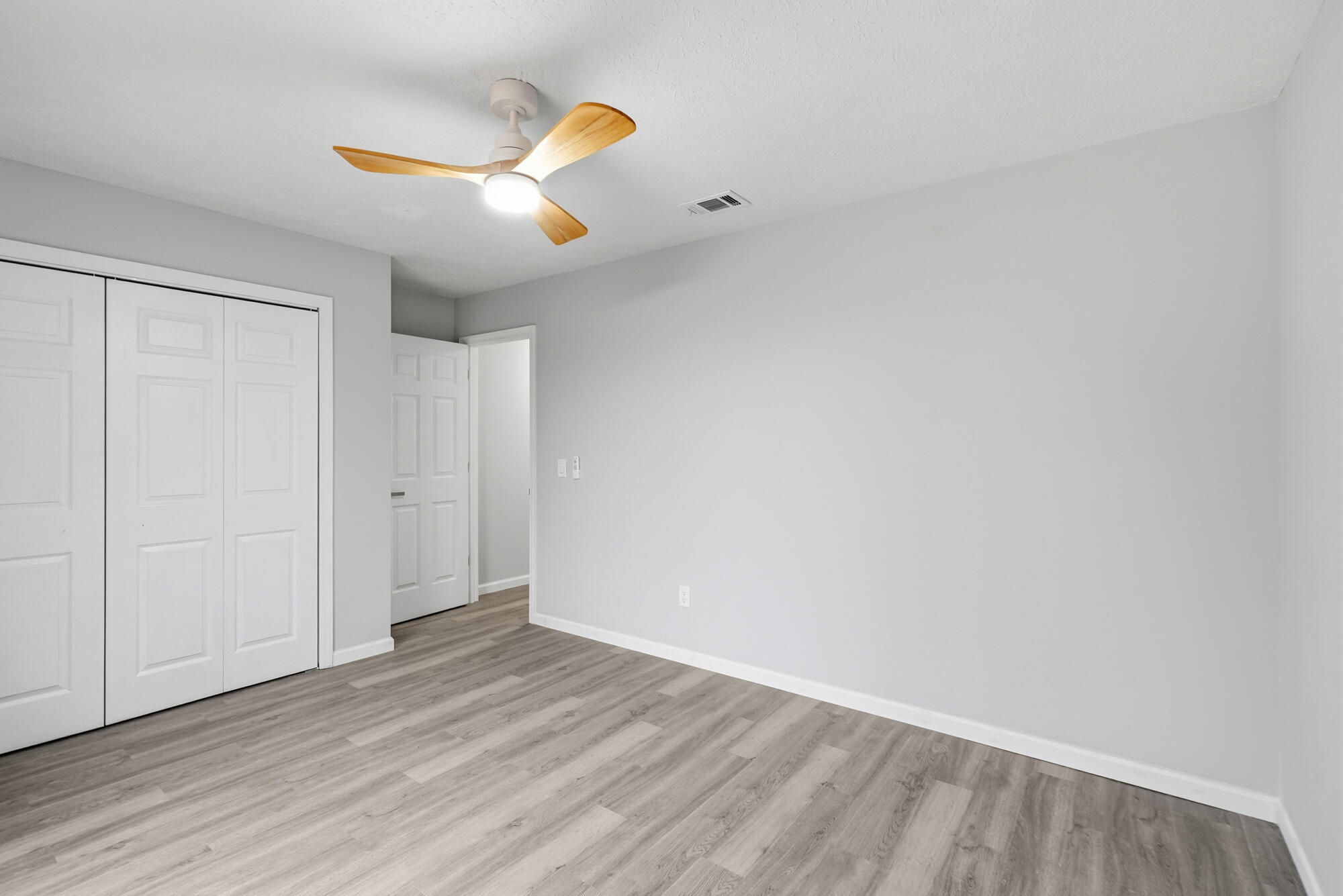 1434 Santa Anita Drive Lynn Haven, FL 32444 - Photo 26 of 38 a view of an empty room and wooden floor