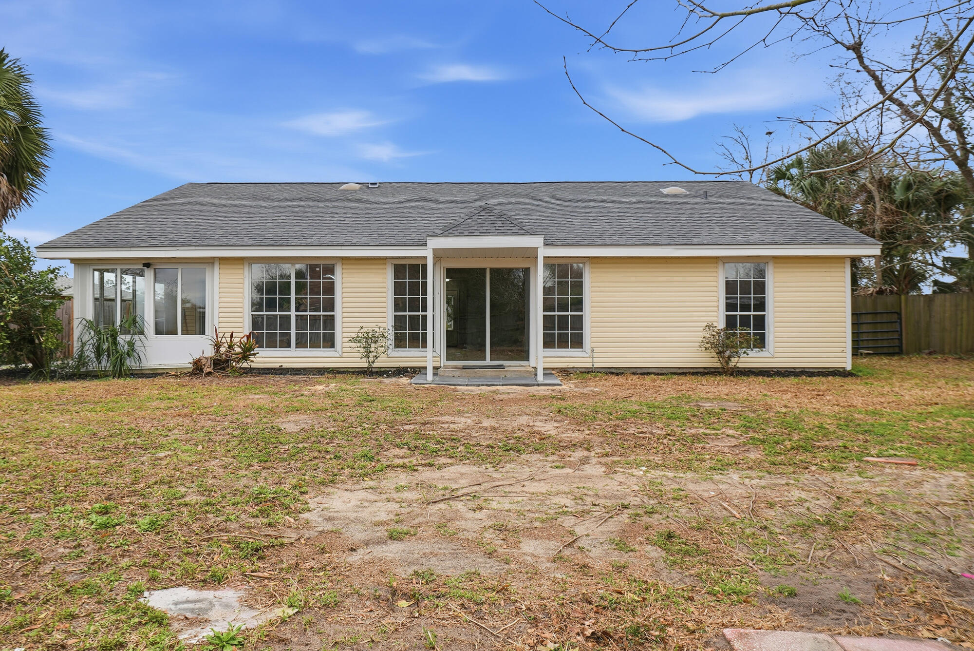 1434 Santa Anita Drive Lynn Haven, FL 32444 - Photo 30 of 38 front view of a house with a yard