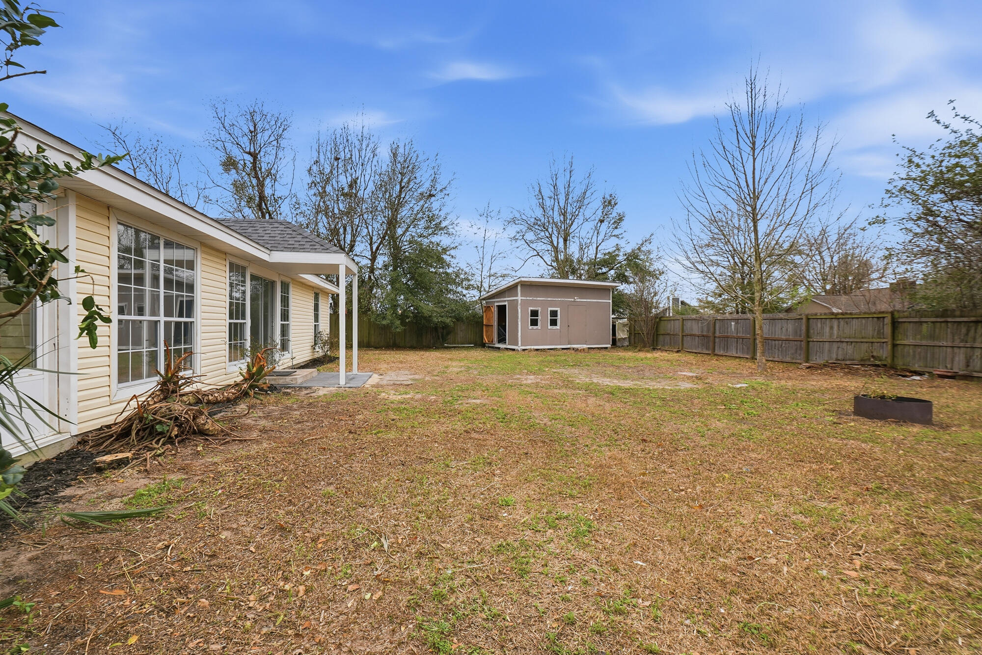 1434 Santa Anita Drive Lynn Haven, FL 32444 - Photo 33 of 38 a front view of a house with a yard and trees