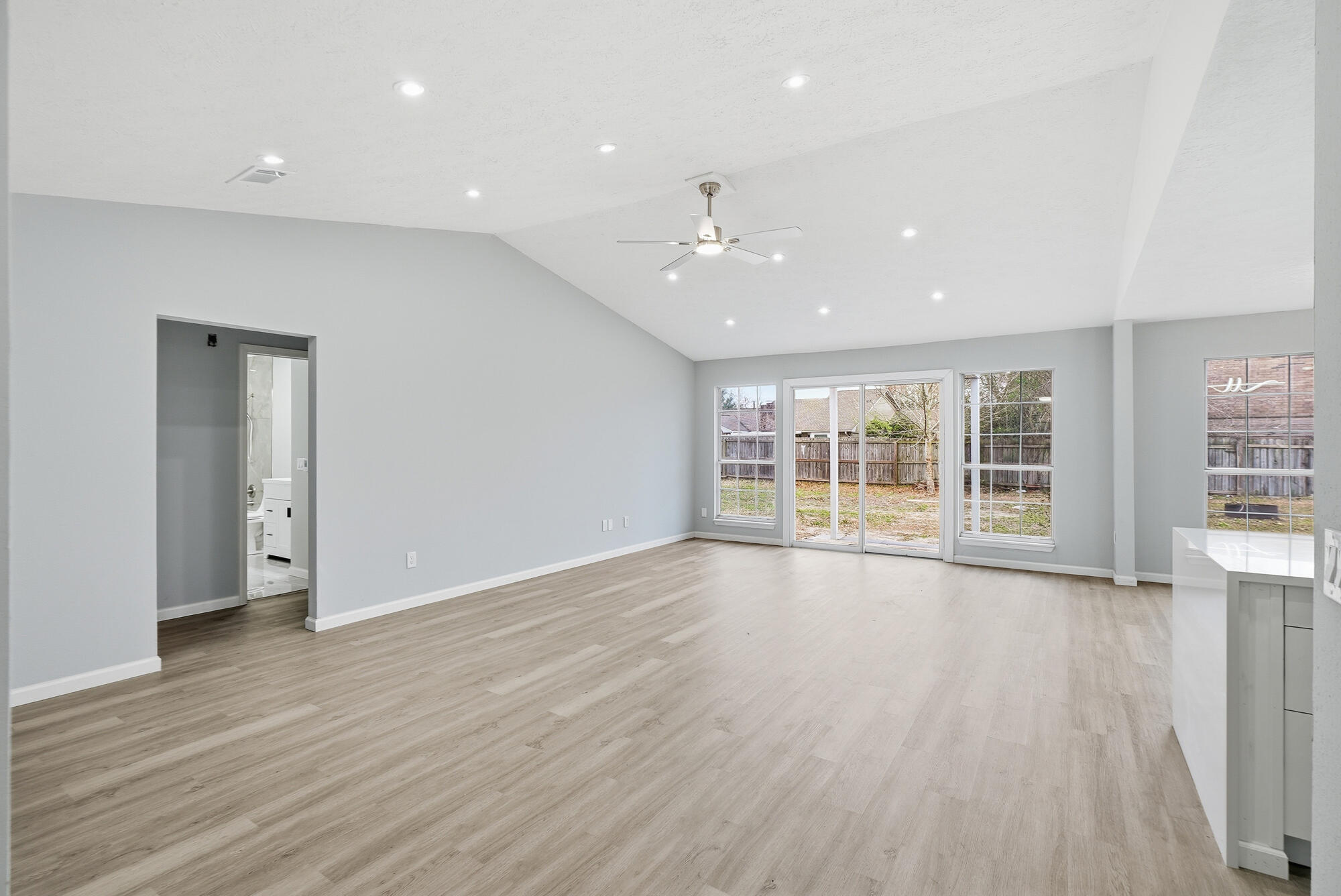 1434 Santa Anita Drive Lynn Haven, FL 32444 - Photo 7 of 38 a view of an empty room with wooden floor and a window