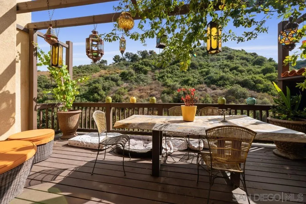 2775 Ridgegate Row La Jolla, CA 92037 - Photo 12 of 59 a balcony with table and chairs