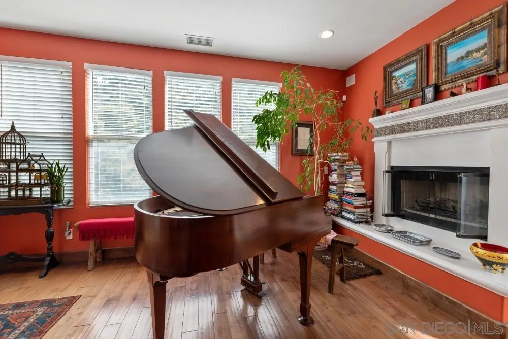 2775 Ridgegate Row La Jolla, CA 92037 - Photo 20 of 59 a living room with furniture and a fireplace