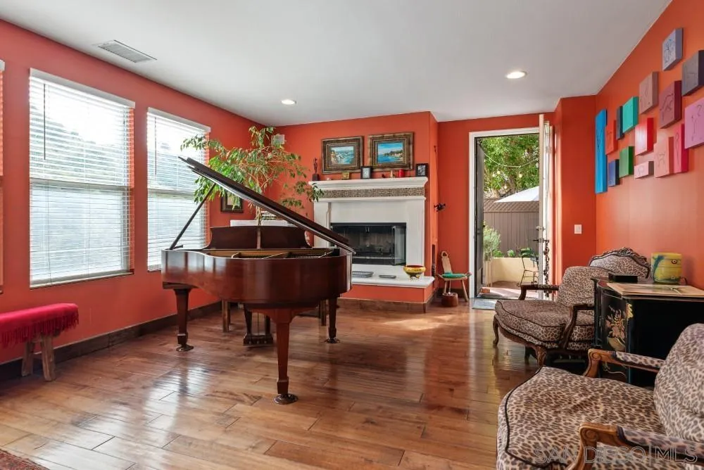 2775 Ridgegate Row La Jolla, CA 92037 - Photo 22 of 59 a living room with furniture a rug and a large window