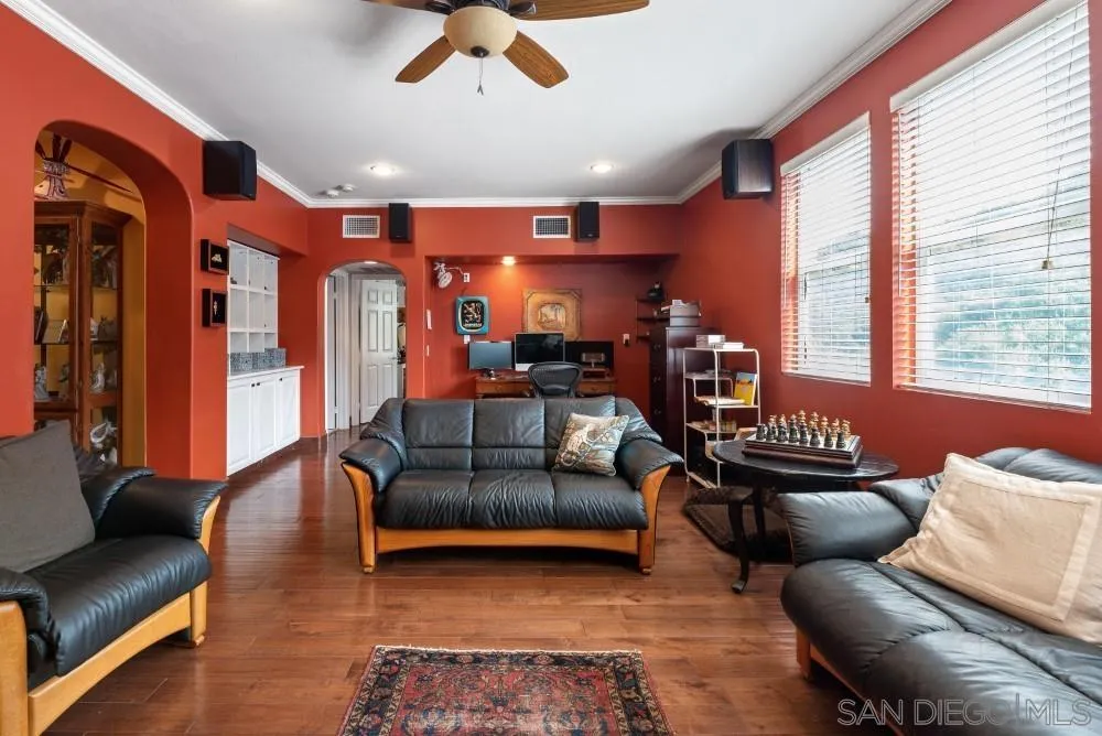 2775 Ridgegate Row La Jolla, CA 92037 - Photo 26 of 59 a living room with furniture and a chandelier