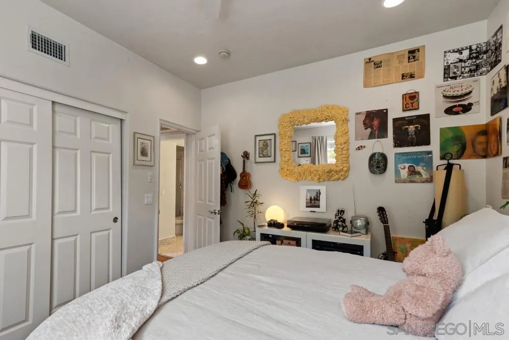 2775 Ridgegate Row La Jolla, CA 92037 - Photo 29 of 59 a bedroom with furniture and a window