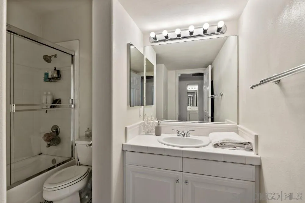 2775 Ridgegate Row La Jolla, CA 92037 - Photo 30 of 59 a bathroom with a toilet sink and shower