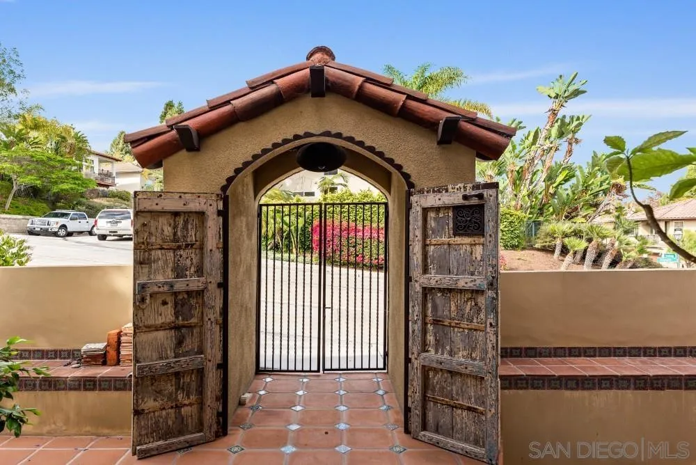 2775 Ridgegate Row La Jolla, CA 92037 - Photo 3 of 59 a front view of a house with a yard