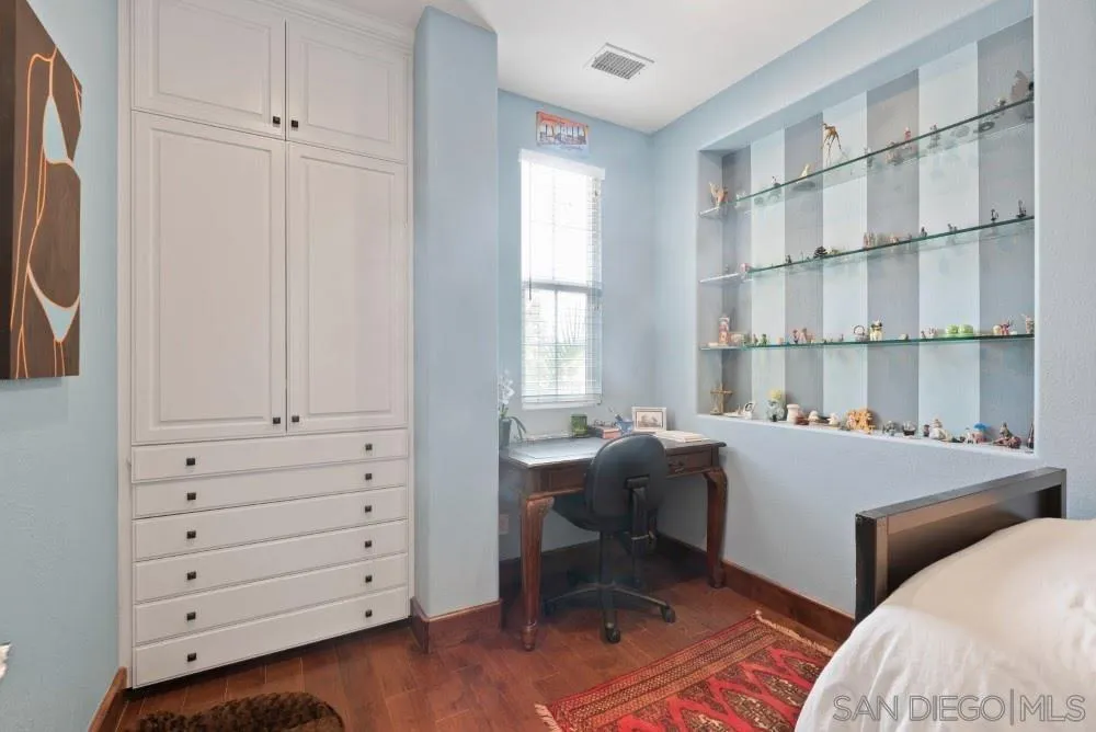 2775 Ridgegate Row La Jolla, CA 92037 - Photo 44 of 59 a room with a dresser and a window