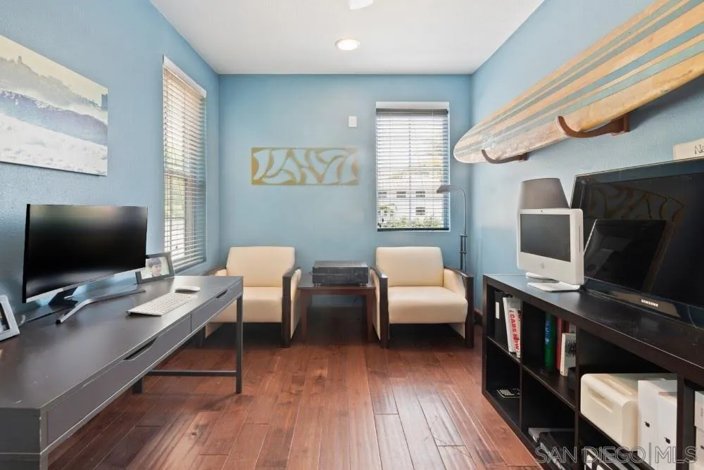 2775 Ridgegate Row La Jolla, CA 92037 - Photo 45 of 59 a living room with furniture and a flat screen tv