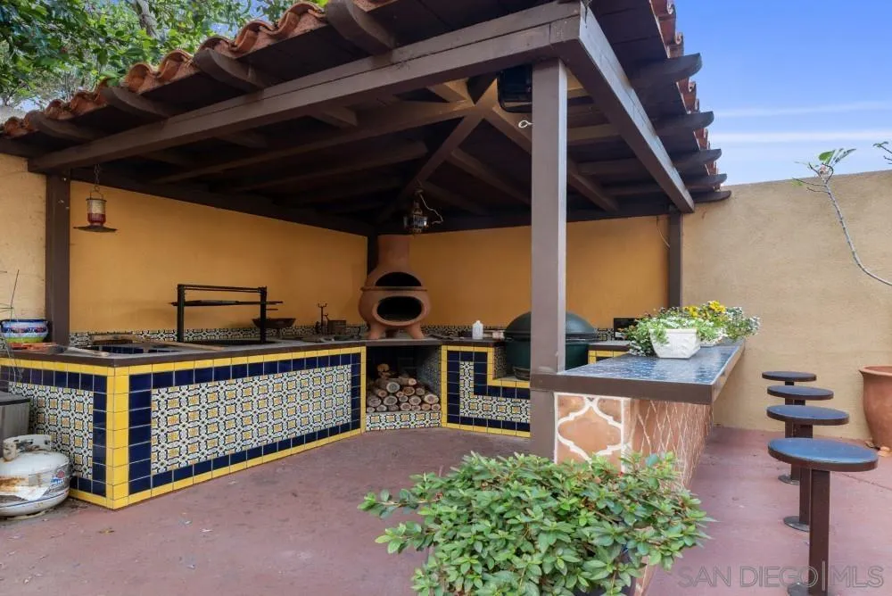 2775 Ridgegate Row La Jolla, CA 92037 - Photo 8 of 59 a view of outdoor kitchen outdoor kitchen outdoor seating and mountain view in back