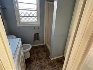 a bathroom with sink and toilet