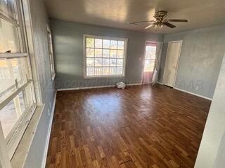 4118 South Harrison Street Amarillo, TX 79110 - Photo 6 of 19 an empty room with wooden floor and windows