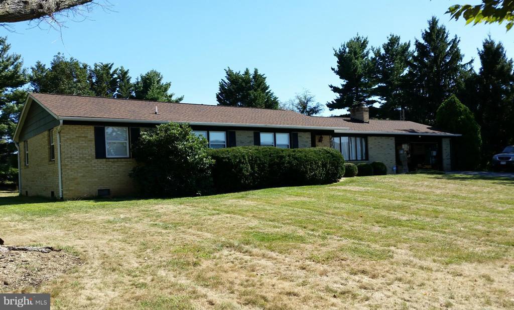 5372 Renn Road Frederick, MD 21703 - Photo 1 of 9 a front view of a house with a yard