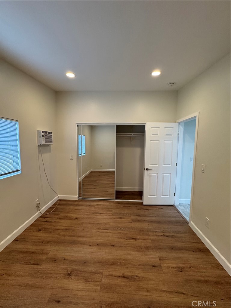 8418 Stewart And Gray Road Downey, CA 90241 - Photo 8 of 17 a view of empty room with wooden floor