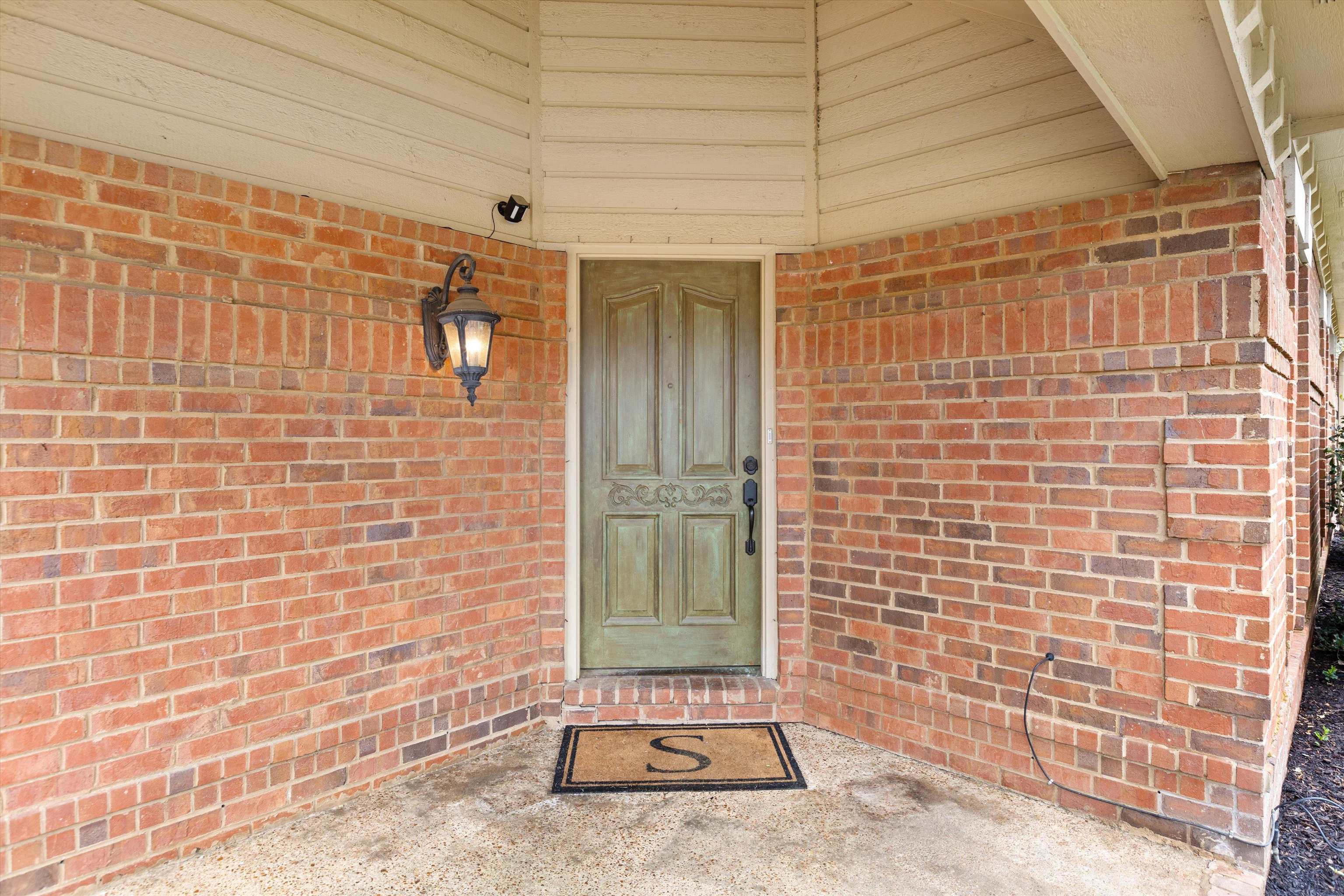 7792 Fawn Ridge Cove Memphis, TN 38016 - Photo 2 of 26 Entrance to property featuring brick siding