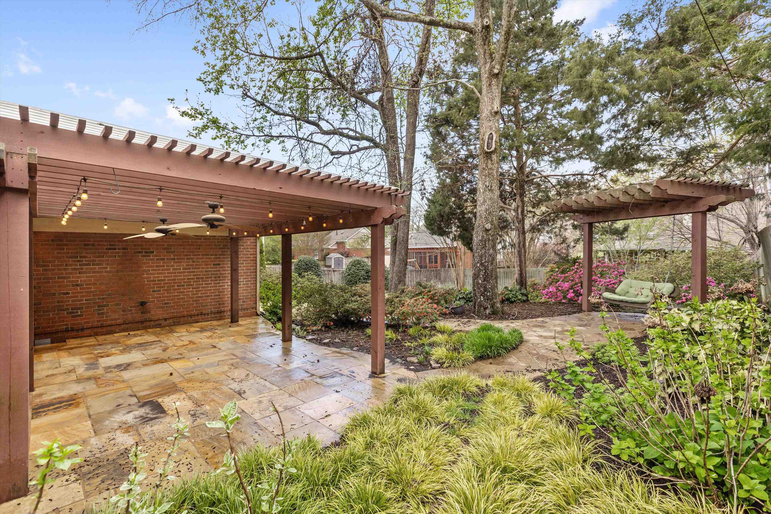7792 Fawn Ridge Cove Memphis, TN 38016 - Photo 23 of 26 View of yard featuring a patio, ceiling fan, and a pergola
