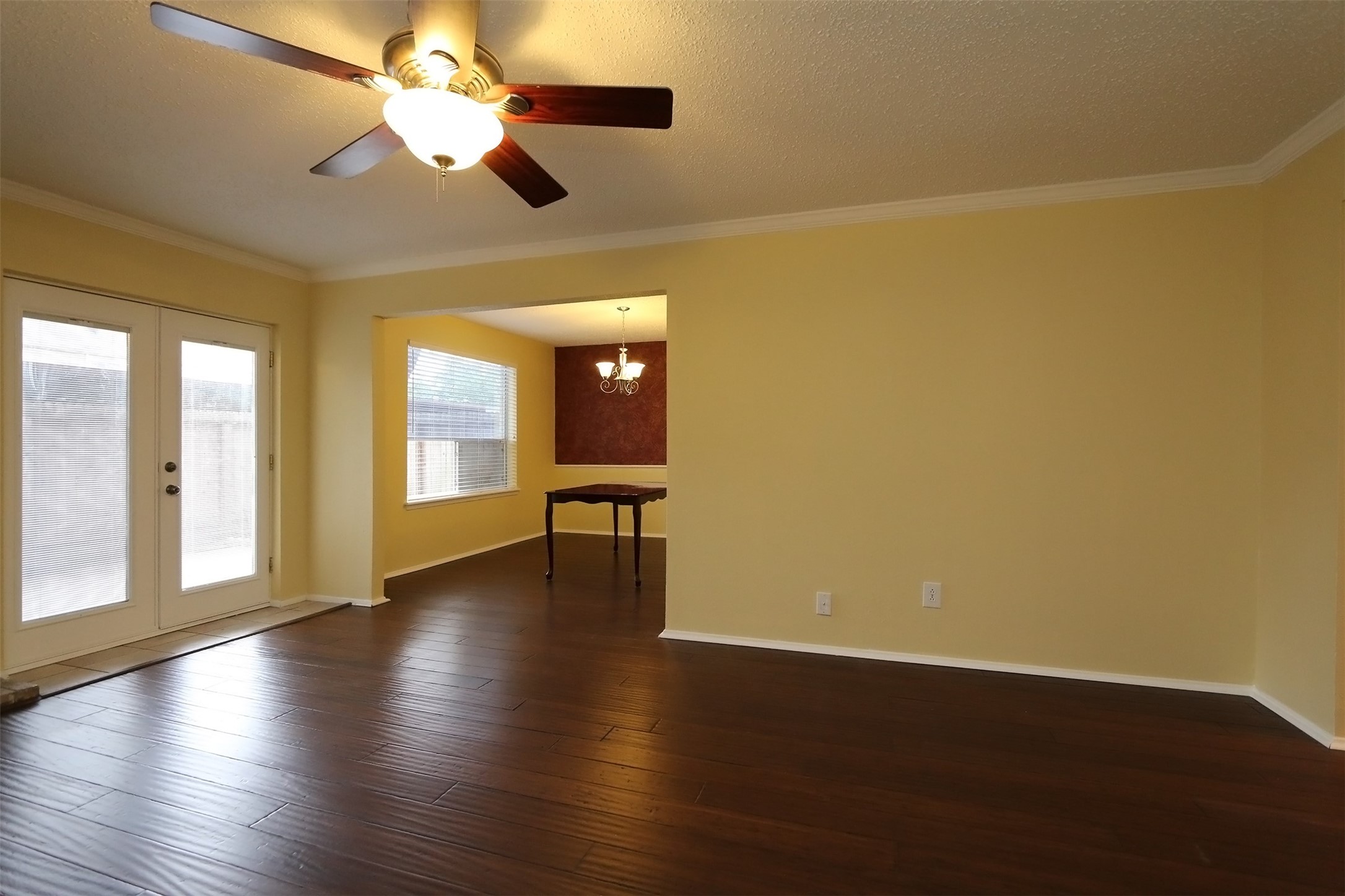6430 Kentwick Drive Houston, TX 77084 - Photo 6 of 26 a view of an empty room with a window and wooden floor