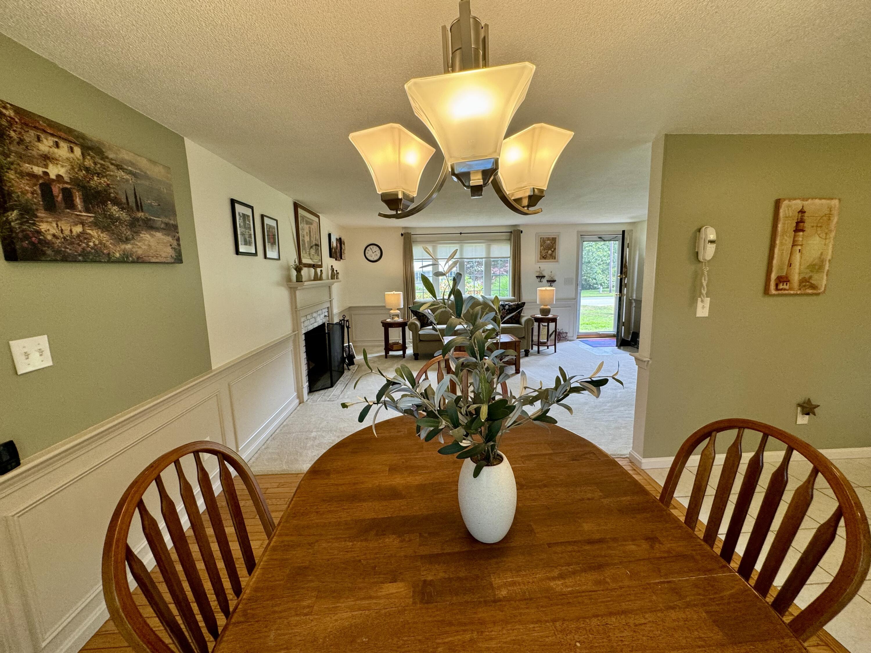 173 Nottingham Drive Centerville, MA 02632 - Photo 13 of 54 a view of a dining room with furniture and chandelier