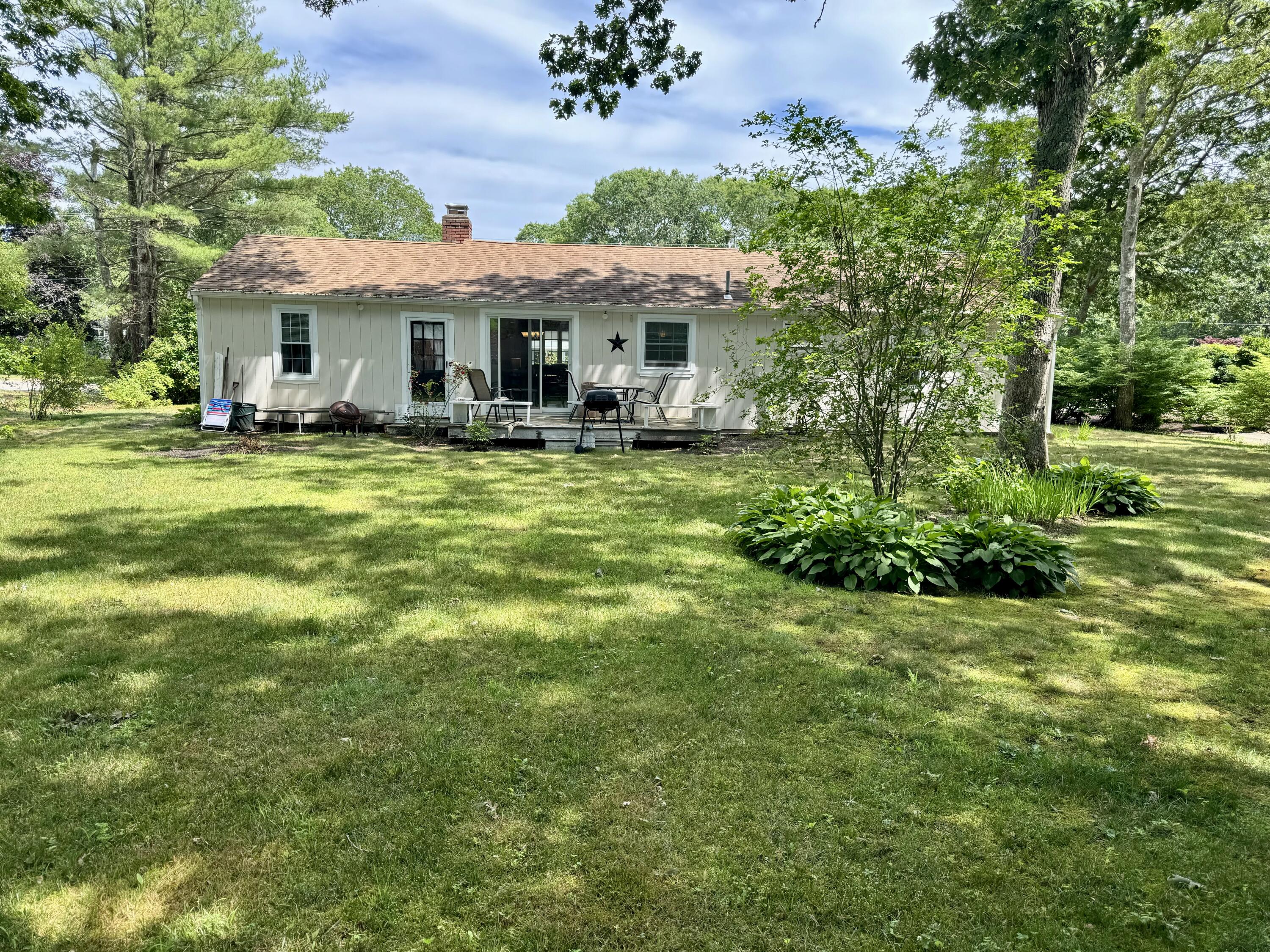 173 Nottingham Drive Centerville, MA 02632 - Photo 35 of 54 a view of a house with a yard