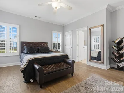 a bedroom with a bed rug and window