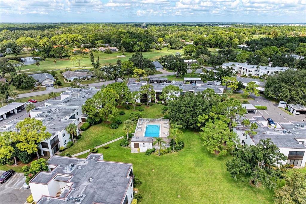 3534 Richwood, Unit 44 Sarasota, FL 34235 - Photo 19 of 26 an aerial view of a house with a yard