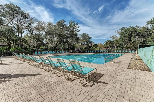 a view of swimming pool with a patio