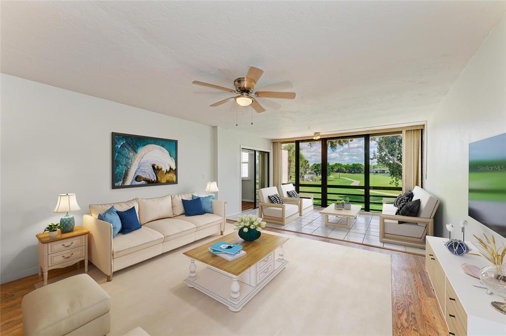 3534 Richwood, Unit 44 Sarasota, FL 34235 - Photo 3 of 26 a living room with furniture and a large window