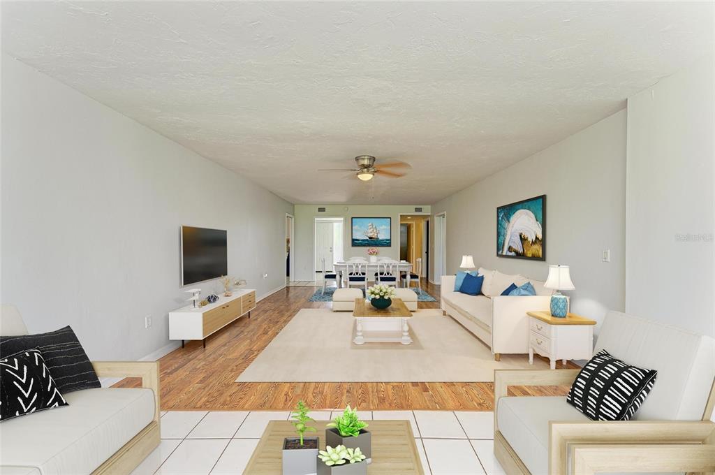 3534 Richwood, Unit 44 Sarasota, FL 34235 - Photo 4 of 26 a living room with furniture and a flat screen tv