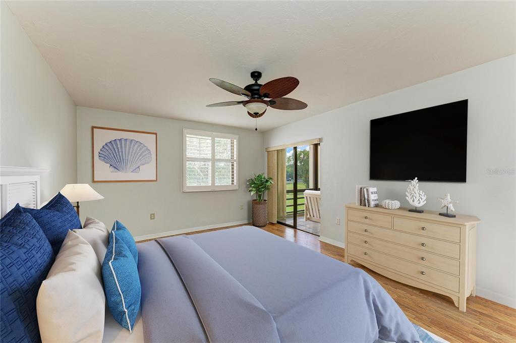 3534 Richwood, Unit 44 Sarasota, FL 34235 - Photo 8 of 26 a bedroom with a bed and a flat screen tv