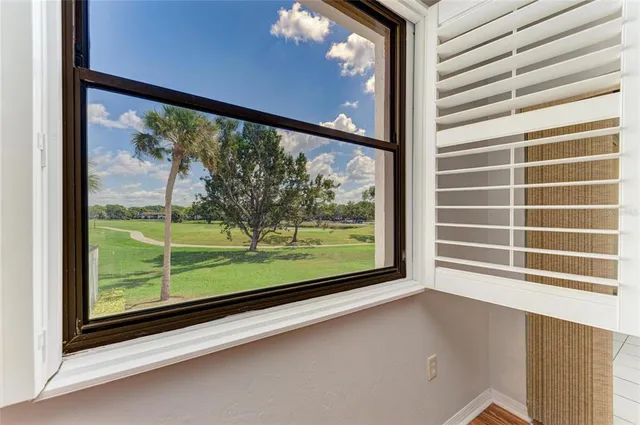 a view of a room with a large window