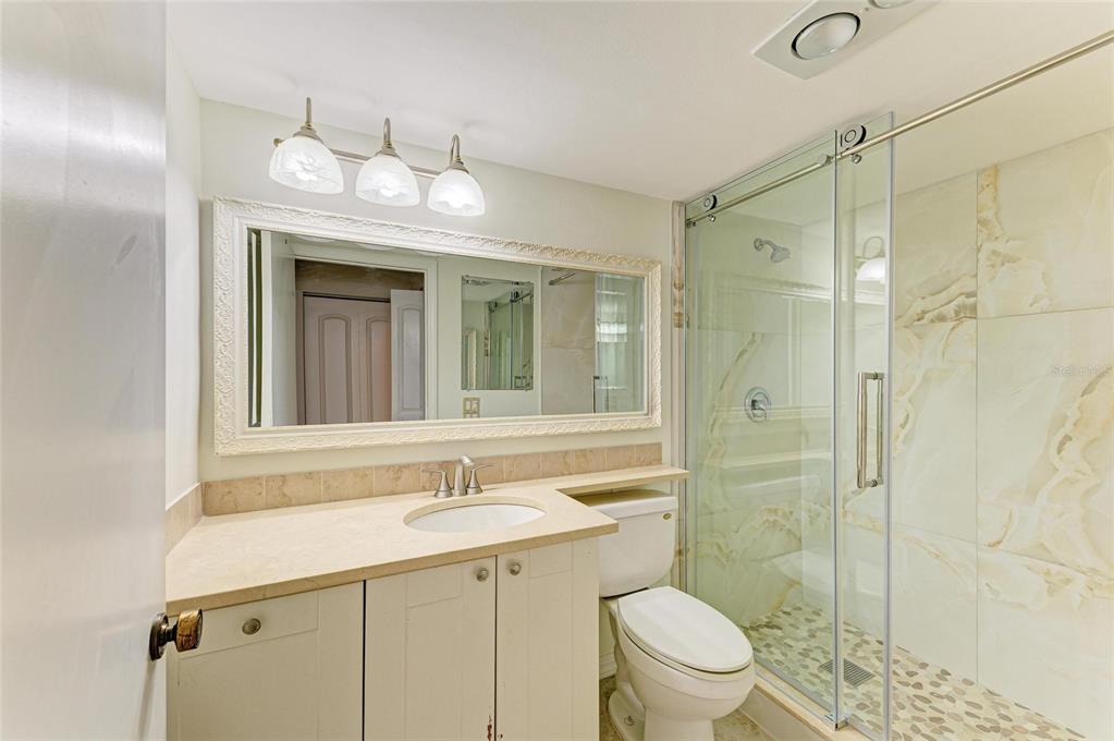 3534 Richwood, Unit 44 Sarasota, FL 34235 - Photo 10 of 26 a bathroom with a sink shower and a toilet