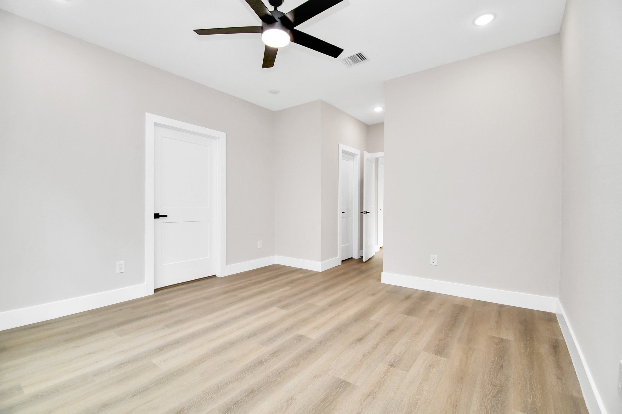 8409 Sunnyhill Street Houston, TX 77088 - Photo 11 of 13 wooden floor in an empty room