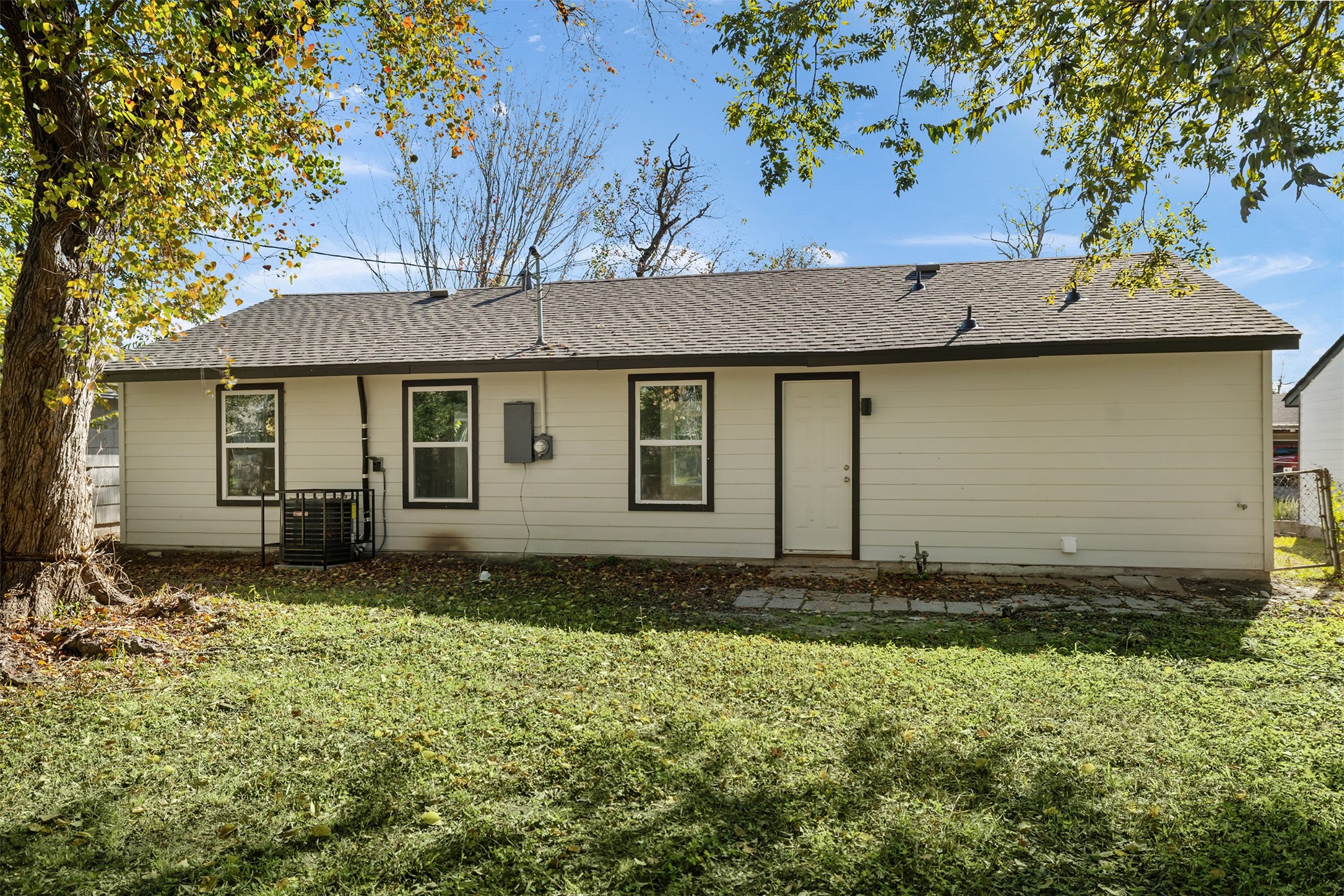 5915 Beldart Street Houston, TX 77033 - Photo 15 of 15 a house with a tree in front of it