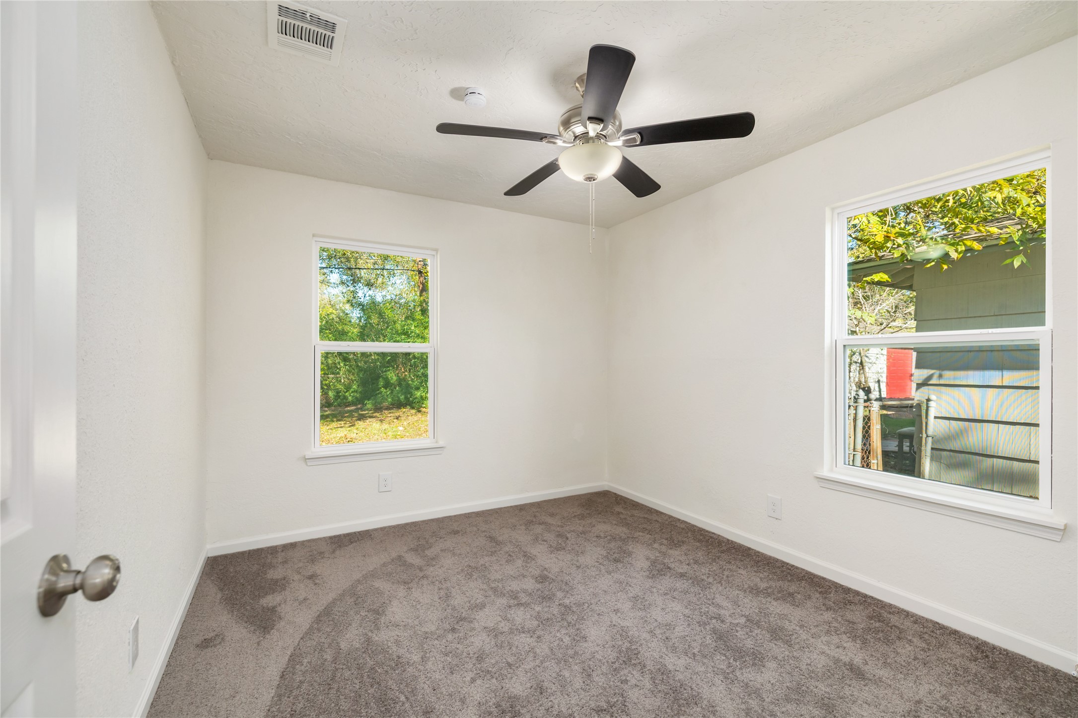 5915 Beldart Street Houston, TX 77033 - Photo 10 of 15 a view of an empty room with a window