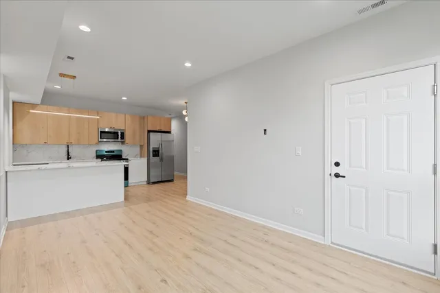 a view of kitchen with wooden floor