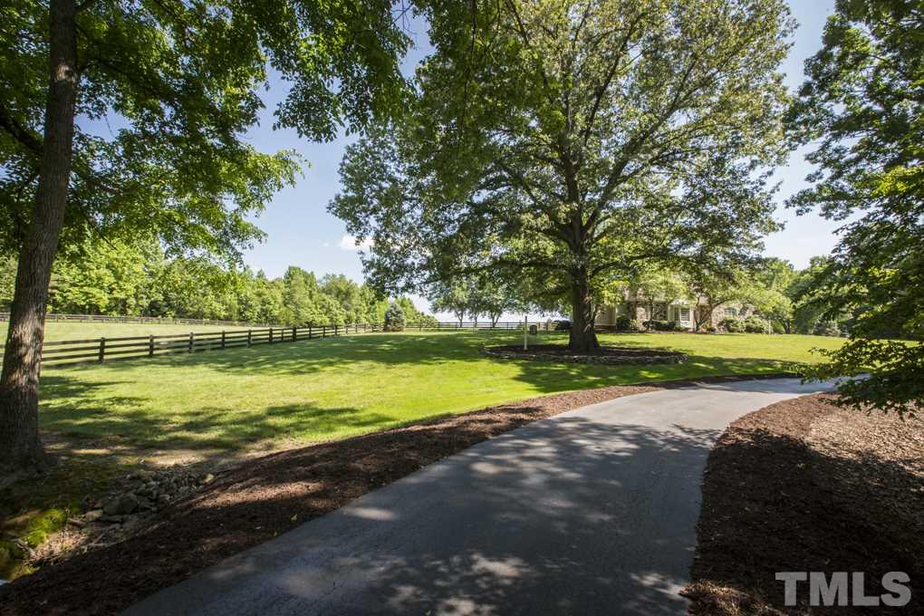 5 Pearse Wynd Road Bahama, NC 27503 - Photo 1 of 25 a view of a park with large trees