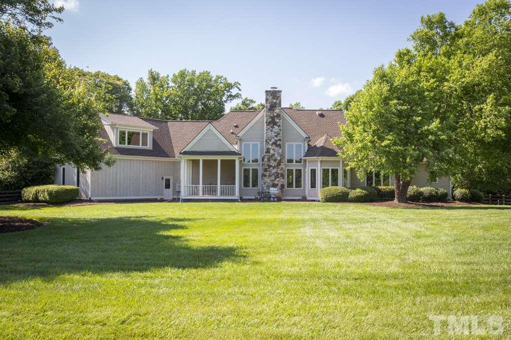 5 Pearse Wynd Road Bahama, NC 27503 - Photo 23 of 25 a front view of a house with a garden