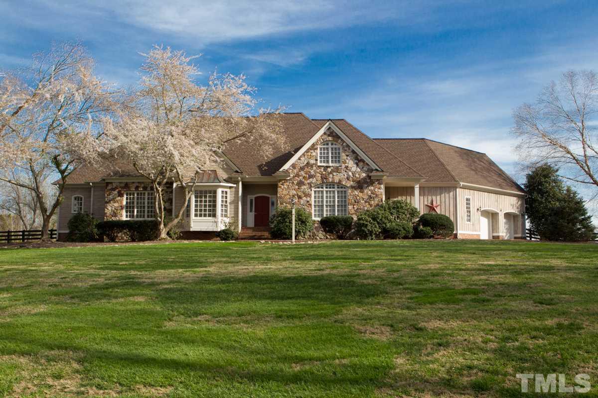 5 Pearse Wynd Road Bahama, NC 27503 - Photo 4 of 25 a front view of a house with a garden