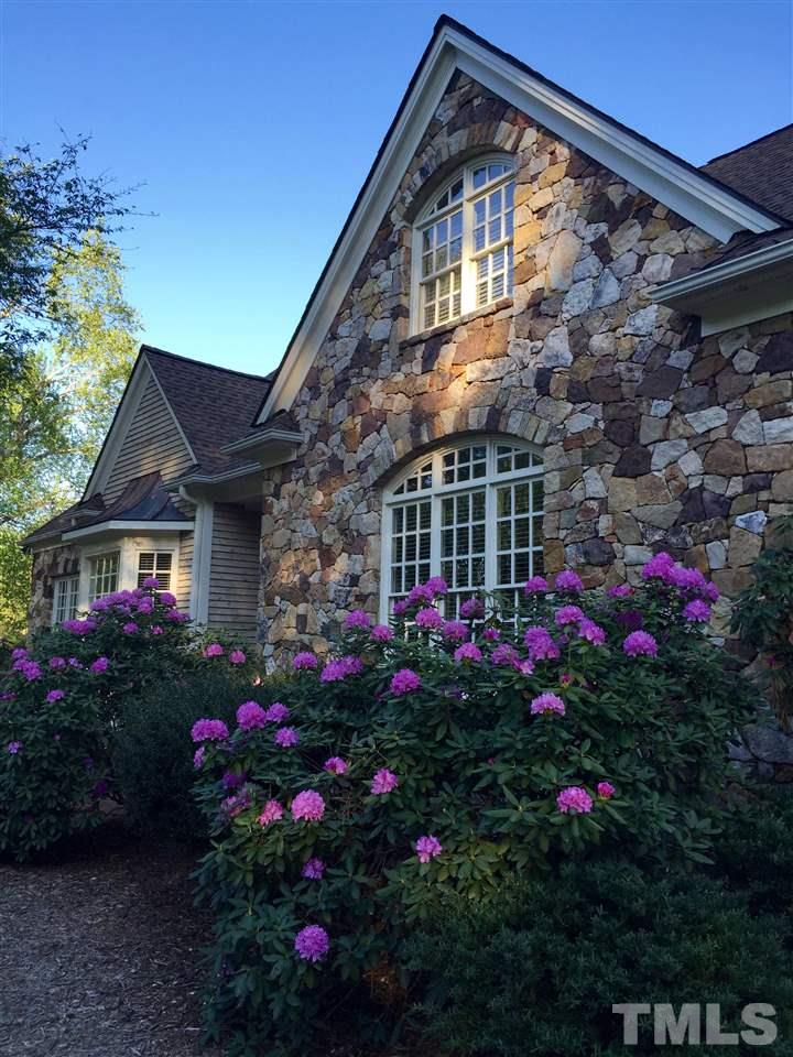 5 Pearse Wynd Road Bahama, NC 27503 - Photo 5 of 25 a view of a house with a flower garden